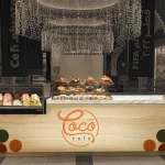 CocoTale cafe logo, tropical brand identity, cup packaging design, Qatar cafe branding